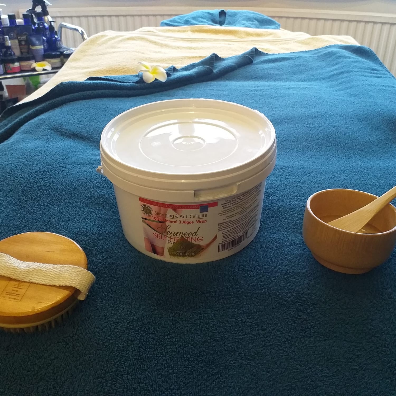 Body spa treatment materials ready on the teal bed